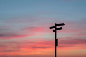 Direction Sign at Sunset Unsplash